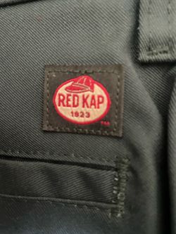 Red Kap work pants in a dark green  color.