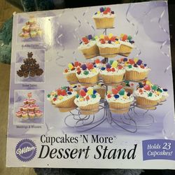 Wilton cupcakes n more dessert station holds 23 cupcakes New box is a little beat up from moving it around 