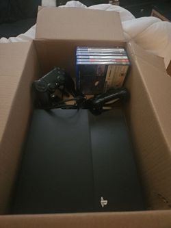 PS4 WITH 2 CONTROLLERS AND 7 GAMES