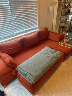 Burnt Orange couch and ottoman