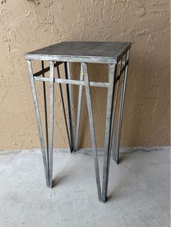 Stylish tall accent table in a beautiful nickel finish. Heavy and sturdy construction with a modern, elegant look. Perfect for high-tech, contemporary