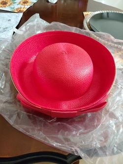 vibrant red woven wide-brim dress hat, with aribbon bow