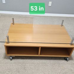 Coffee Table with Tempered Glass and Wheels – In Excellent Condition!
