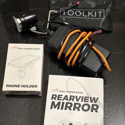 Rad Runner parts (All Brand New) charger, a rad runner mirror, headlight, rad runner phone holder, rad runner toolkit