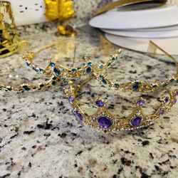 Crowns two turquoise one green, one purple, one dark gold