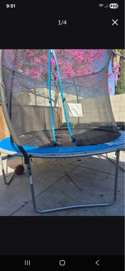 Trampoline with safety enclosure