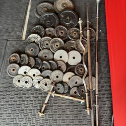 Standard weights 325lbs total plus 6ft bar and curl bar plus dumbbells handles