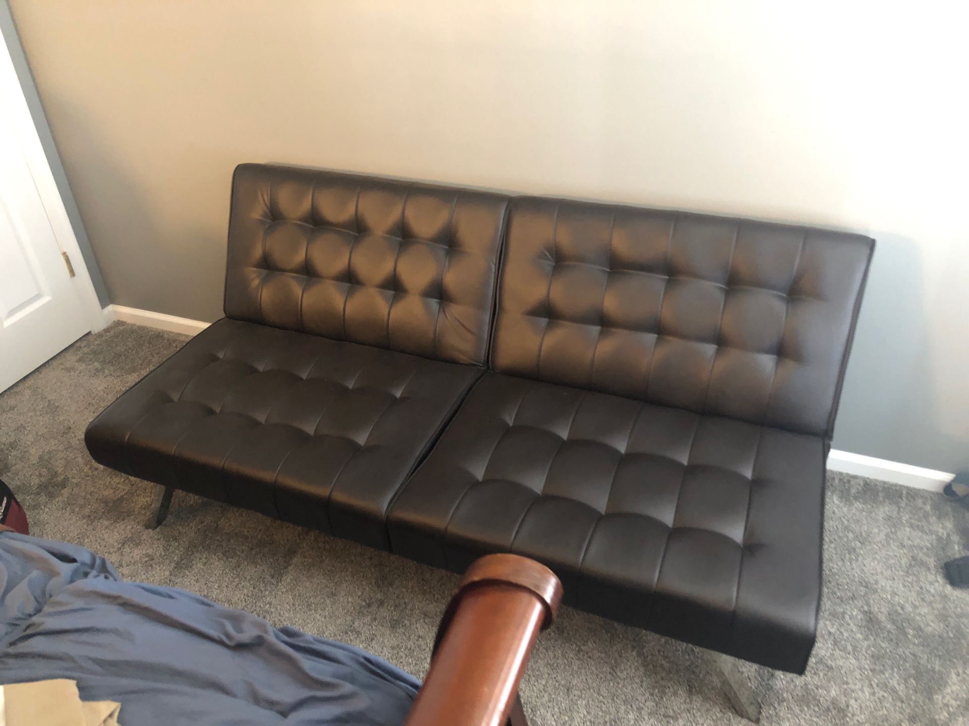Faux leather multi position futon