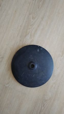 A very heavy piece of metal what was formerly a Mike stand base.