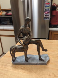 Woman with her beloved dog sculpter