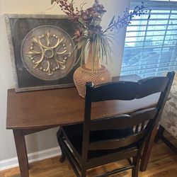 Desk w Black Chair  flower decor /picture