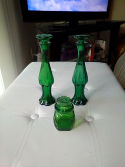 Green glass avon bottles and jar