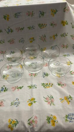 Six clear footed glass dessert cups