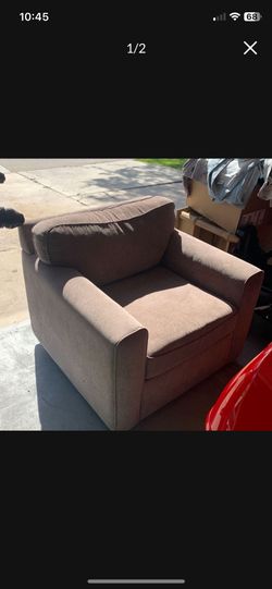 Living Spaces Rocking recliner arm chair