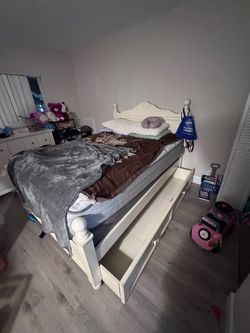 Bed frame with mattresses