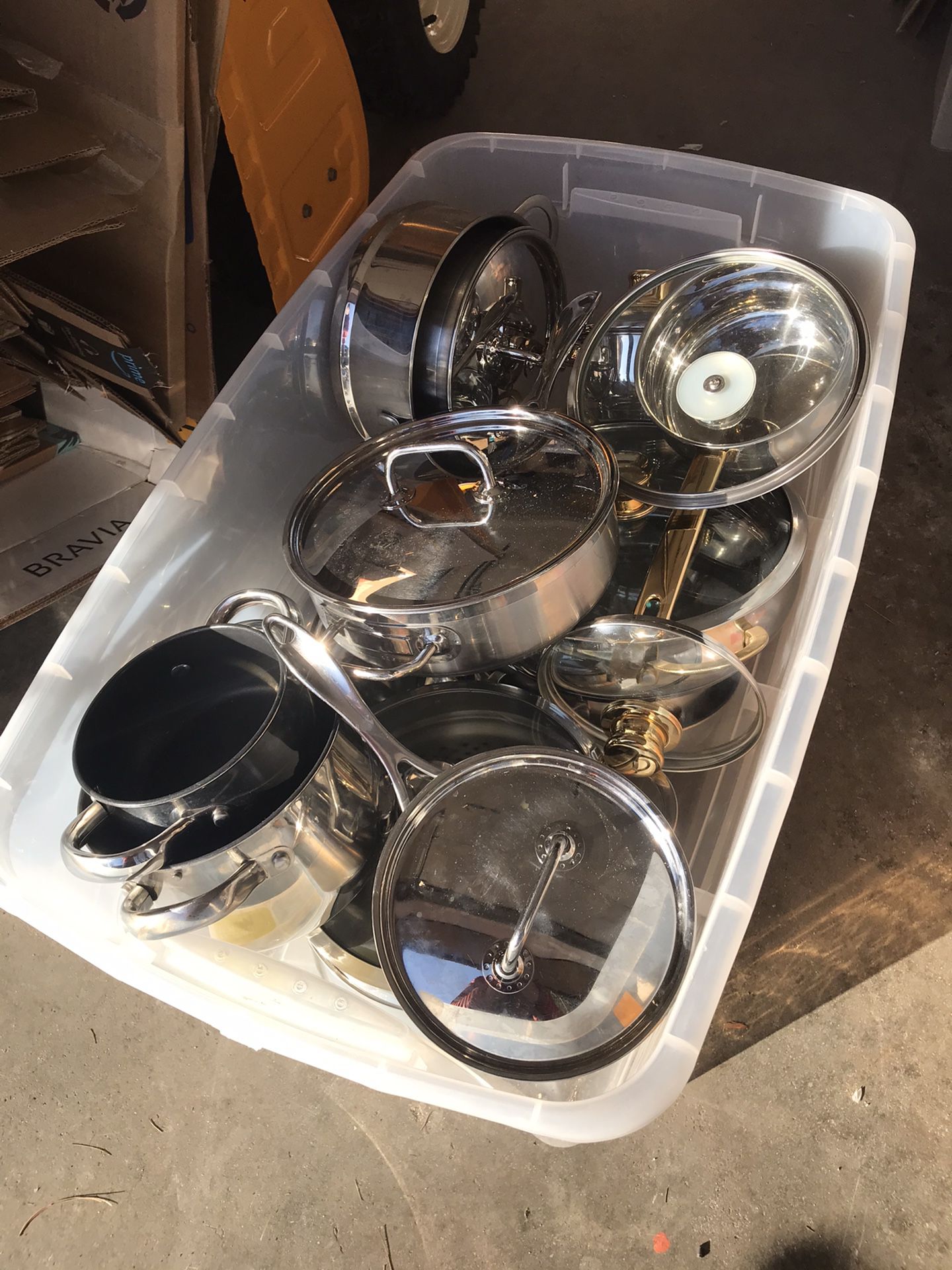 Large bin of like- new pots and pans