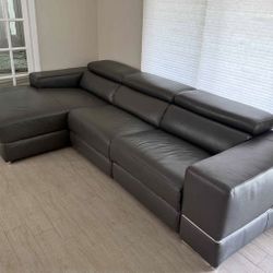 Sofa/ sectional with motorized foot rest. Excellent condition.