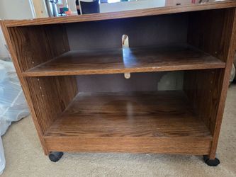 Brown wood shelf on wheels