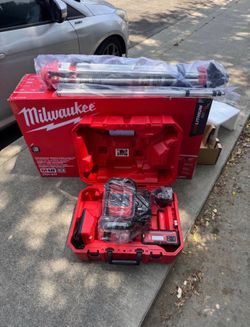 Milwaukee M18 2000 ft. Red Exterior Rotary Laser Level Kit with Receiver, Receiver Clamp, Tripod, an
