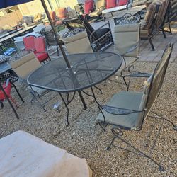$300  IRON ROCKING 4 CHAIRS AND BIG OVAL TABLE 