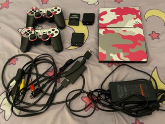 PlayStation 2 Slim w/Three PS2 Games