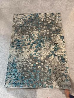 Abstract area rug , grey/light blue, 4’ x 5’7”