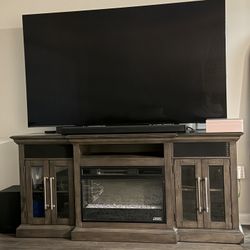 TV Stand, Fire Place, Speakers. 