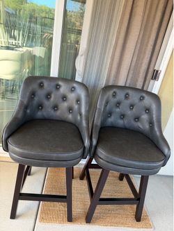 2 swivel tufted barstools