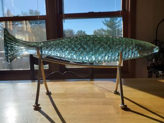 Solid Glass fish on stainless steel pedestal ...9" high x 20" long