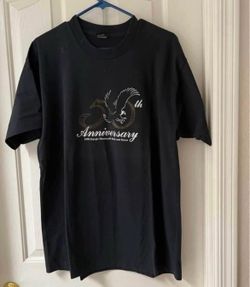 This 1990 Sturgis Motorcycle Rally 50th Anniversary t-shirt is a vintage black crewneck featuring a prominent graphic of a Harley-Davidson eagle logo