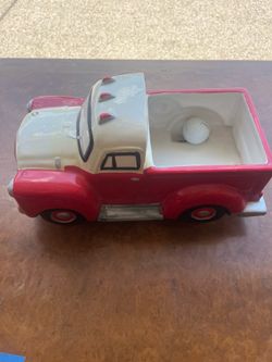 vintage-style ceramic pickup truck planter , designed to look like a classic 1950s Chevy or Ford stepside truck