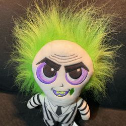 Beetlejuice plush excellent condition  iconic character signature black and white striped suit, black boots, and wild green hair. The doll has a detai