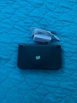 New Nintendo 3DS XL with Charger and 64GB SD Card