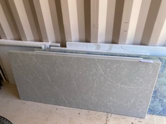 Beautiful Quartz Countertop 26”x58-1/4” with a 2 inch manufactured edge on the front and left