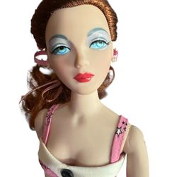 The Gene Marshall doll is a collectible fashion doll inspired by Hollywood's Golden Age.  Size: The doll stands 15.5 inches (approximately 39.4 cm) ta