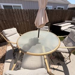 Table and chairs with cushions