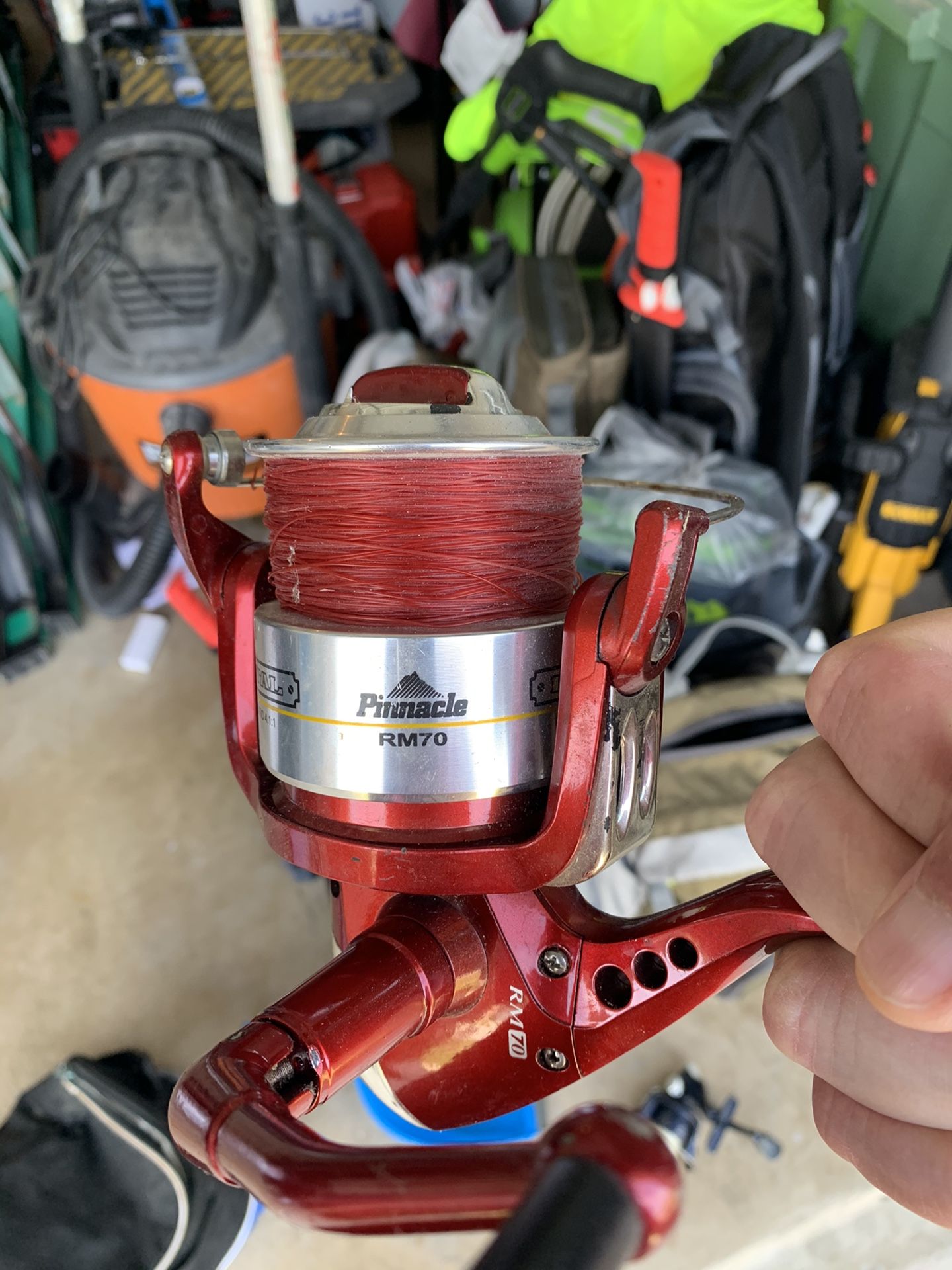 Pinnacle red metal spinning fishing reel
