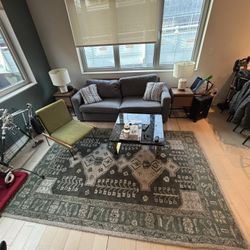 Couch With Pull Out Bed, Table And Carpet
