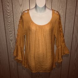 est. 1946 size medium mustard colored rayon boho style flowy shirt with open designed sleeves and large sleeve bottoms. Super cute and soft and worn