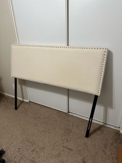 Cream Upholstered Headboard with Nailhead Trim