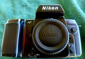 NIKON N8008s auto focus camera, lenses filters, extra battery pack camera strap.All you see in picture