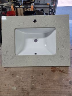 New greige quartz countertop with mounted sink