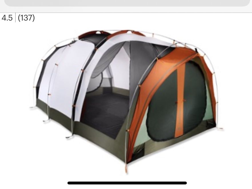 REI Kingdom person camping Tent