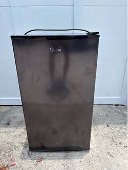 Mini refrigerator with freezer.