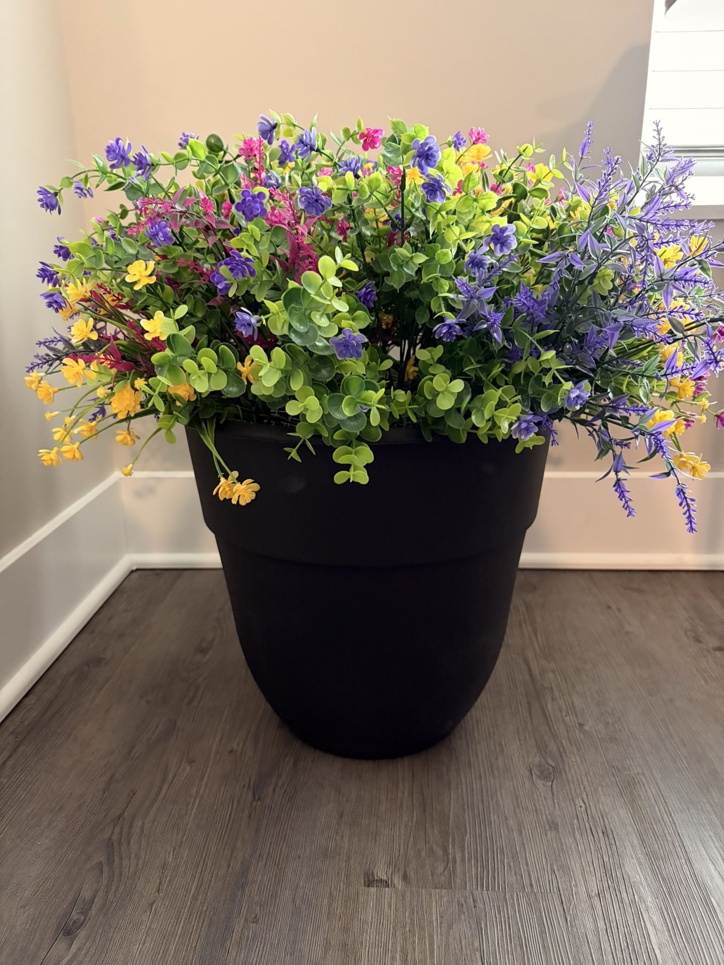 Large Beautiful planter of fade and water resistant flowers.