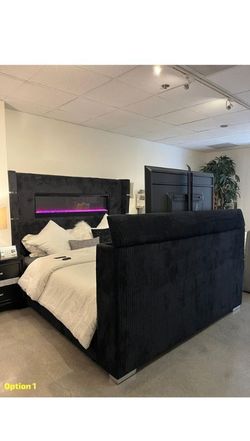 Upholstered Fireplace Bed features 10 color ambient lighting & motorized TV Lift