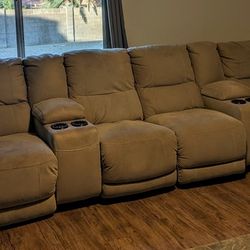 Four Piece Electric Reclining Sofa.