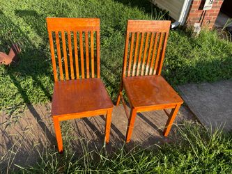 Pair of solid wood mission style dinning chairs.