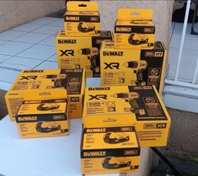 THREE BRAND NEW DEWALT XR BRUSHLESS HAMMER DRILLS AND THREE 20V MAX 4AH BATTERY PACKS
