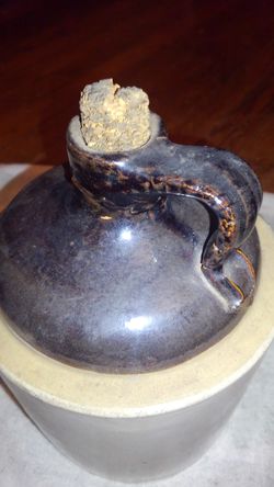 Old crock moonshine jug